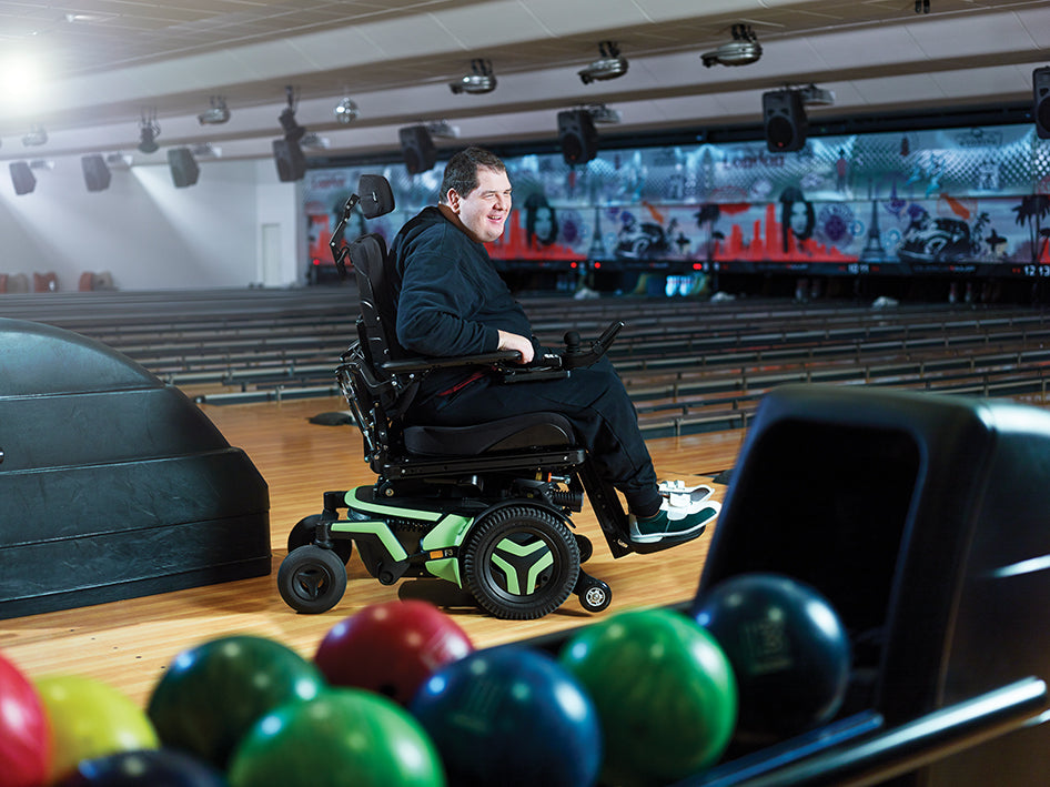 Permobil F3 Corpus in a bowling alley